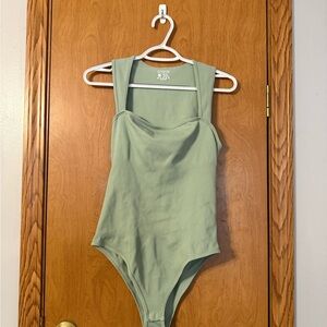 Sleek Green Ribbed Bodysuit